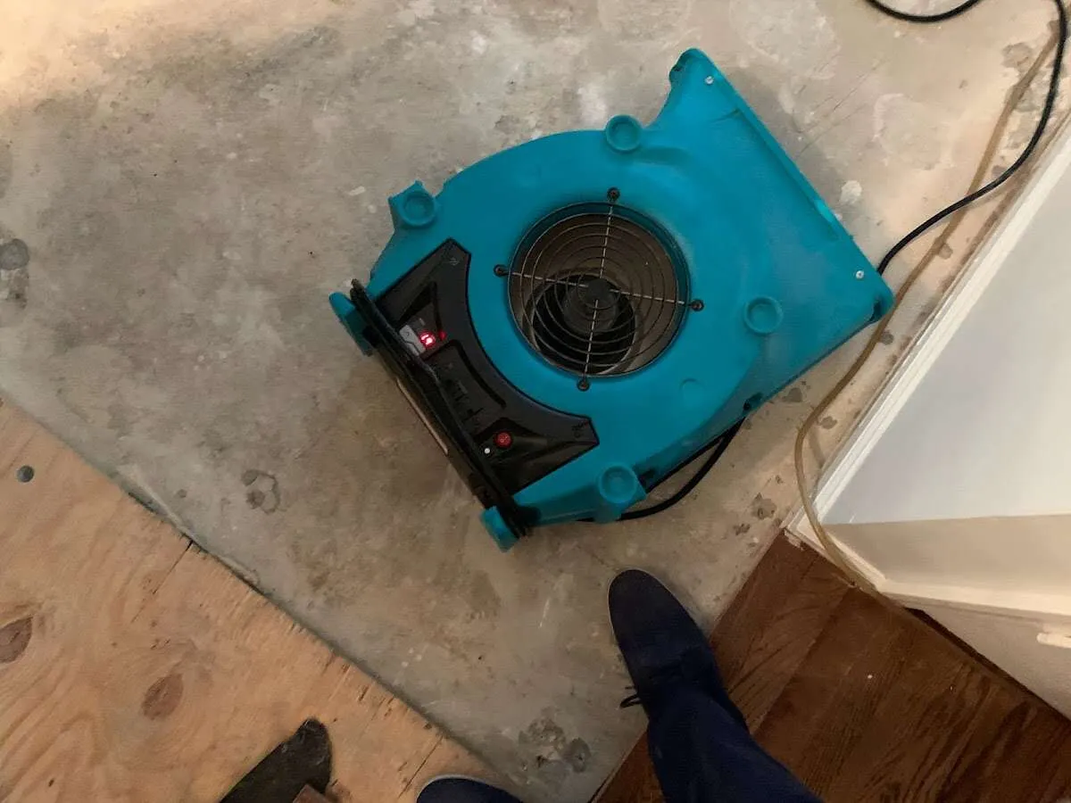 Air mover drying subfloor during Commercial Water Damage Restoration in Golden Hills